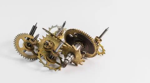 Old clockwork mechanisms on a white background Photos