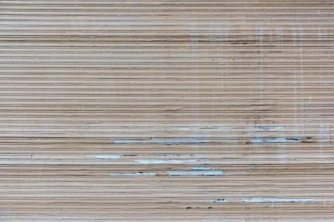 A old closed broken brown roller shutter Stock Photos