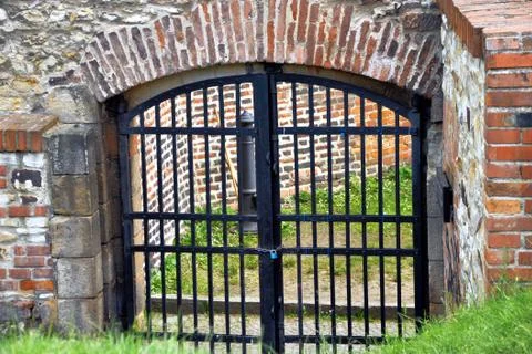 Old closed gate into the castle Stock Photos