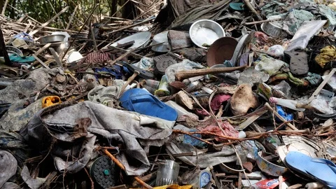 Old clothes and things in forest, remains of traditional burial, Trunyan, Bali Stock Footage 140275640
