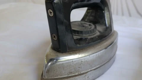 The Old Clothes Iron On A Table Stock Footage 104298221