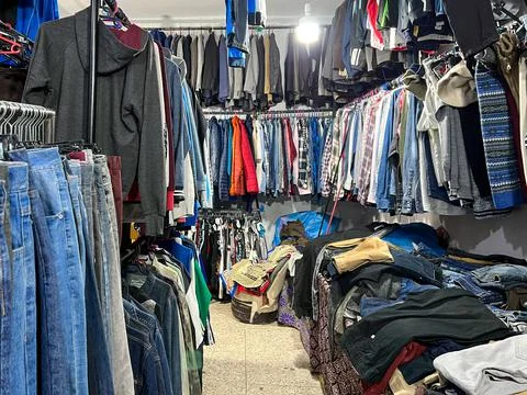 Old clothes in a second hand shop in Morocco Stock Photos