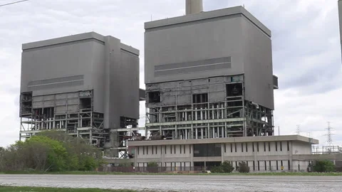 Old coal fired electrical power plant generating station being torn down Stockbeeldmateriaal 153938096