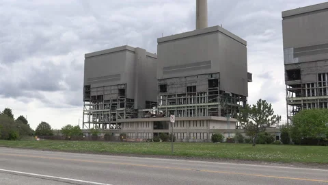 Old coal powered electrical power generating station being torn down Stock Footage 153953718