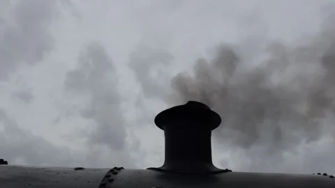 Old coal train releases dark smoke under stormy overcast sky Video stock 319977964