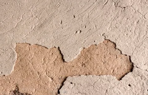 Old cob wall with cracked surface Stock Photos