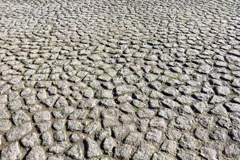 Old cobble stone paving perspective background. Paving stone pavement textu.. Stock Photos