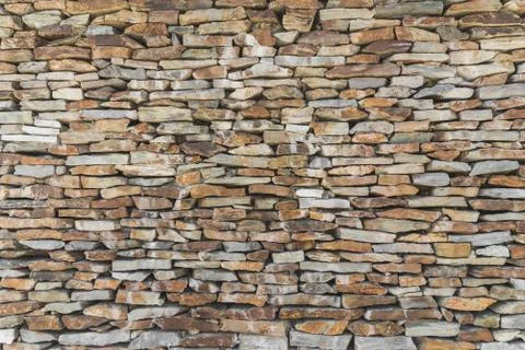 Old cobble stone wall background and pattern. Stock Photos