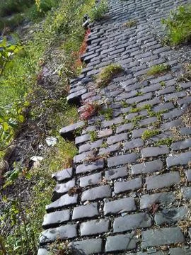 Old Cobbled Path Train line Broken Industry Dishevelled Victorian Brick Stock Photos