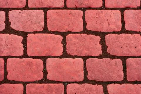 Old cobblestone background with grass. The view from the top Stock Photos