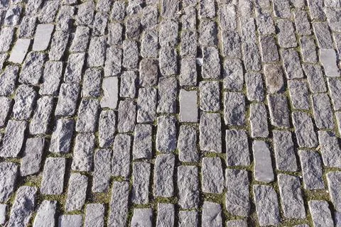 Old cobblestone footpath texture Stock Photos