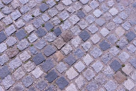 Old cobblestone pavement close-up background and texture Stock Photos
