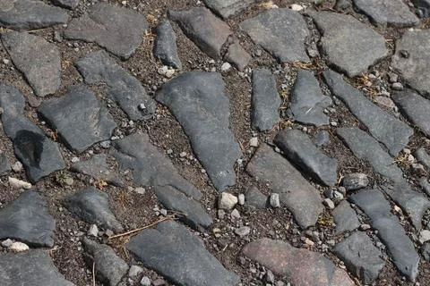 Old Cobblestone Pavement Surface with Large Stone Blocks and Small Gravel Stock Photos