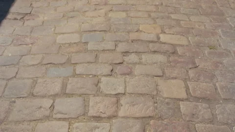 Old cobblestone pavement texture in warm daylight Stock Footage 338445802