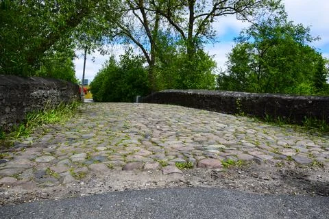Old Cobblestone Road Bridge Stone Parapet Green Trees Summer Urban Stock Photos