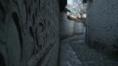An old cobblestone street with high stone fences on both sides. Stock-Footage 336895469