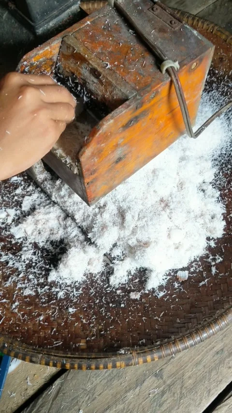 Old coconut grinding machine to make coconut milk Stock Footage 306269802