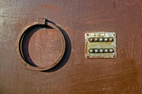 Old coded lock with round buttons on the iron door, close-up, old painted door Stock Photos