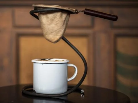 Old coffee filter and the cup Stock Photos