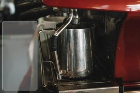 Old coffee machine, with one iron mug, espresso is poured into it Fotos Stock