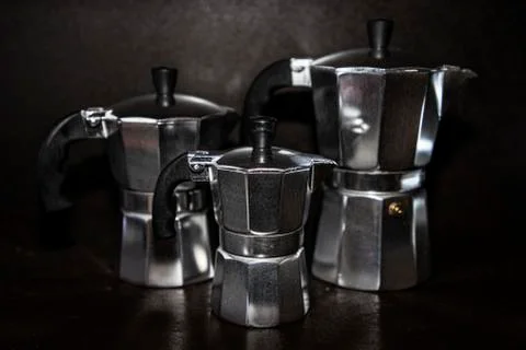 Old coffee machines of different sizes Stock Photos