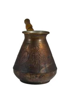 The old coffee maker out of copper with a wooden handle. Stock Photos