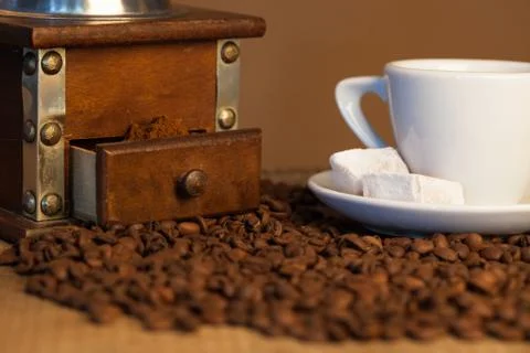 Old coffee mill on dark rustic background Stock Photos