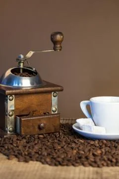 Old coffee mill on dark rustic background Stock Photos