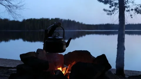 Old coffee pot on camping fire. Stock Footage 138100691