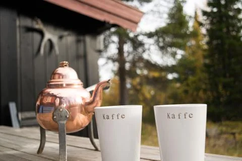 Old coffee pot with cups Stock Photos