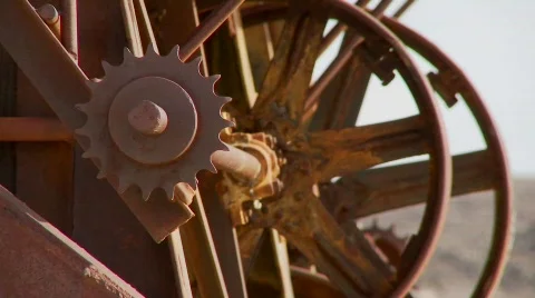 Old cogwheels rust in the sun at an abandoned mine. Stock Footage