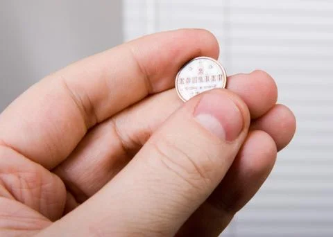 Old coin in hand Stock Photos