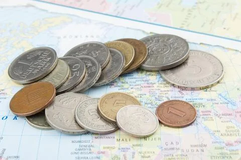 Old coins on map Stock Photos