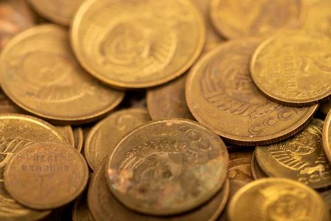 Old coins out of circulation in bulk, background image, close-up, selective f Stock Photos