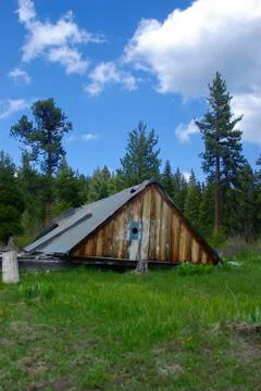 Old colapsed mountain cabin Stock Photos