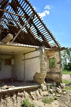 Old collapsed abandoned house without front wall Photos