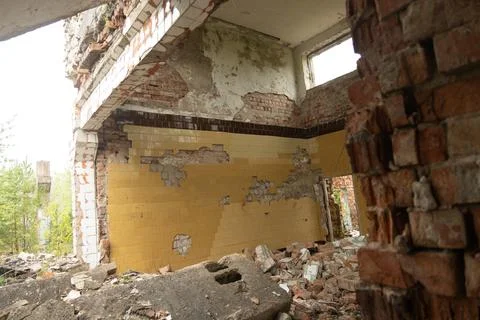 An old, collapsed building of Soviet army base in Latvie, Europe. Stock Photos