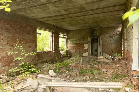 An old, collapsed building of Soviet army base in Latvie, Europe. Stock Photos