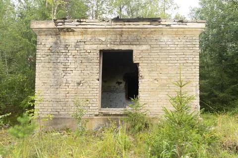 An old, collapsed building in soviet army base in Latvia, Europe. Stock Photos