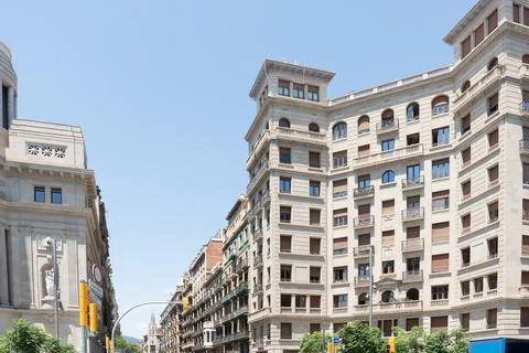 Old Colonial building facade with windows in Barcelona, Spain. Stock Photos