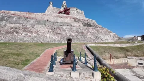 Old Colonial Cannon Pointing Towards Castillo de San Felipe de Barajas Stock Footage 338425708