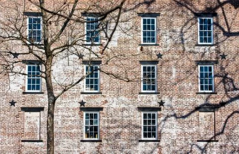 Old colonial general store brick building exterior at Allaire Village Stock Photos