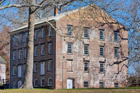 Old colonial general store brick building exterior at Allaire Village Stock Photos