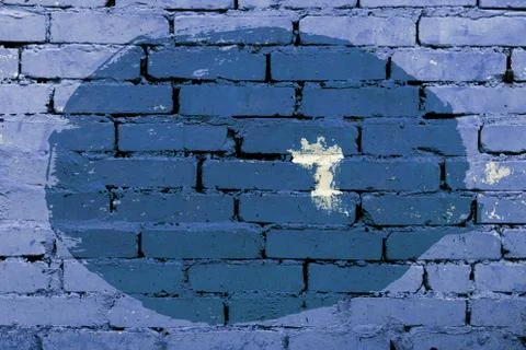 Old colored background of an uneven circle on a brick wall Stock Photos