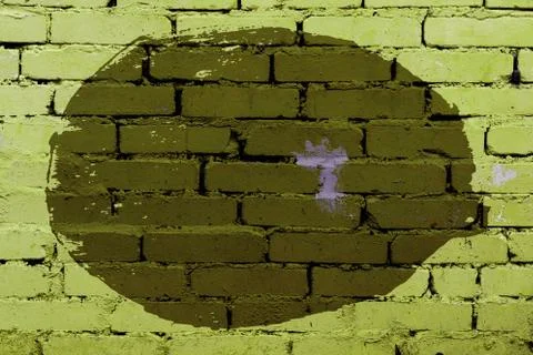 Old colored background of an uneven circle on a brick wall Stock Photos