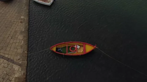 Old colored rowing boat docked at the port Video stock 159447380