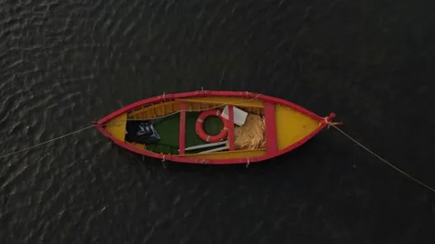 Old colored rowing boat docked at the port Stock Footage 159448253