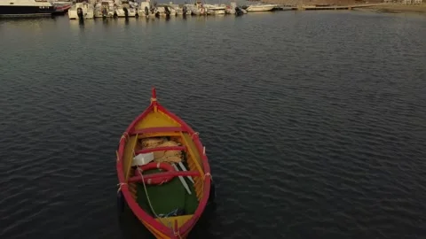 Old colored rowing boat docked at the port Stock Footage 159507355