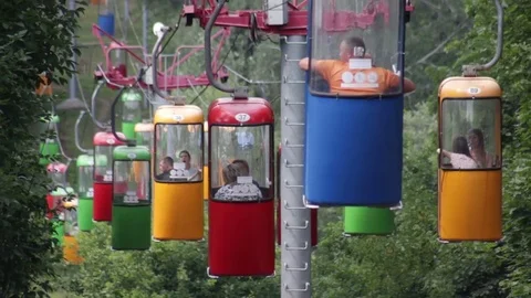 Old colored skyrail cableway among the trees Stock Footage