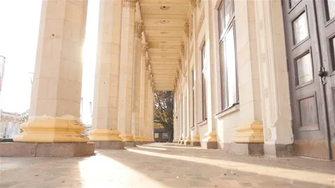 Old columns on a background of beautiful sun rays. Ukraine. Kiev. 07.11.18 Park Stock Footage 103425600